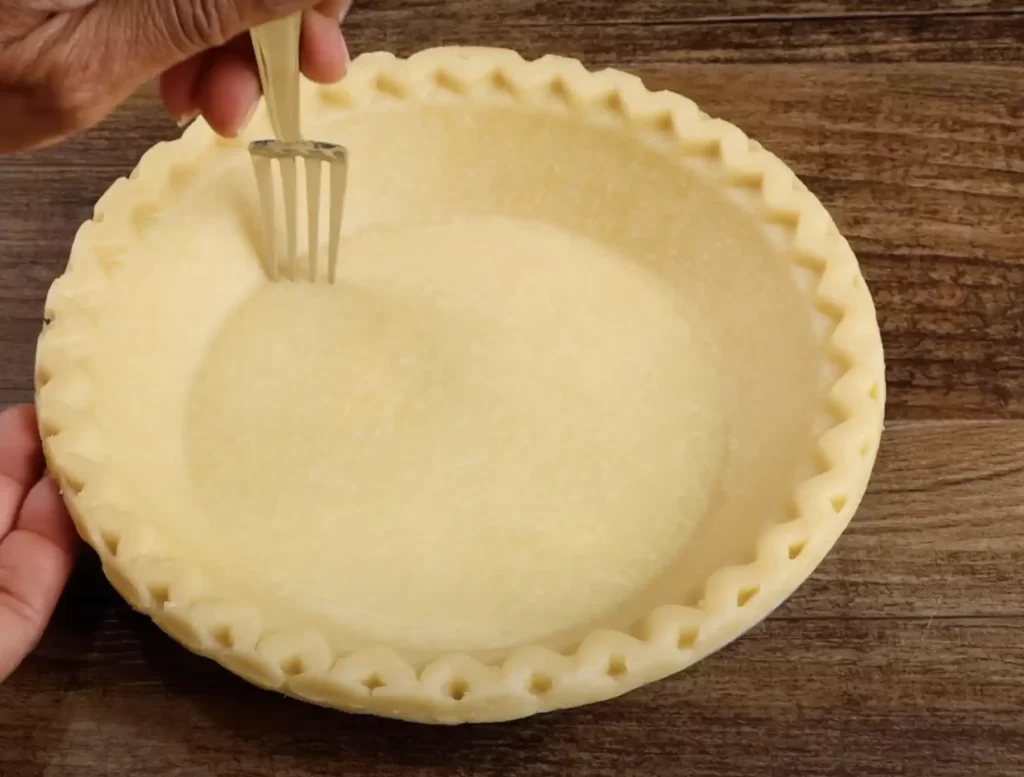 preparing pie crust for banana cream pie